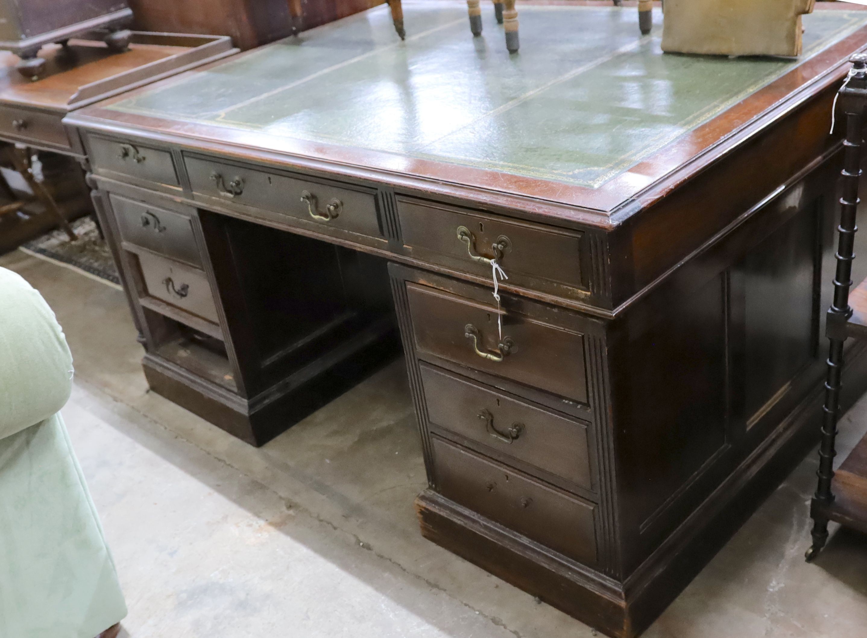 An early 20th century mahogany pedestal partner's desk, length 152cm, depth 112cm, height 77cm